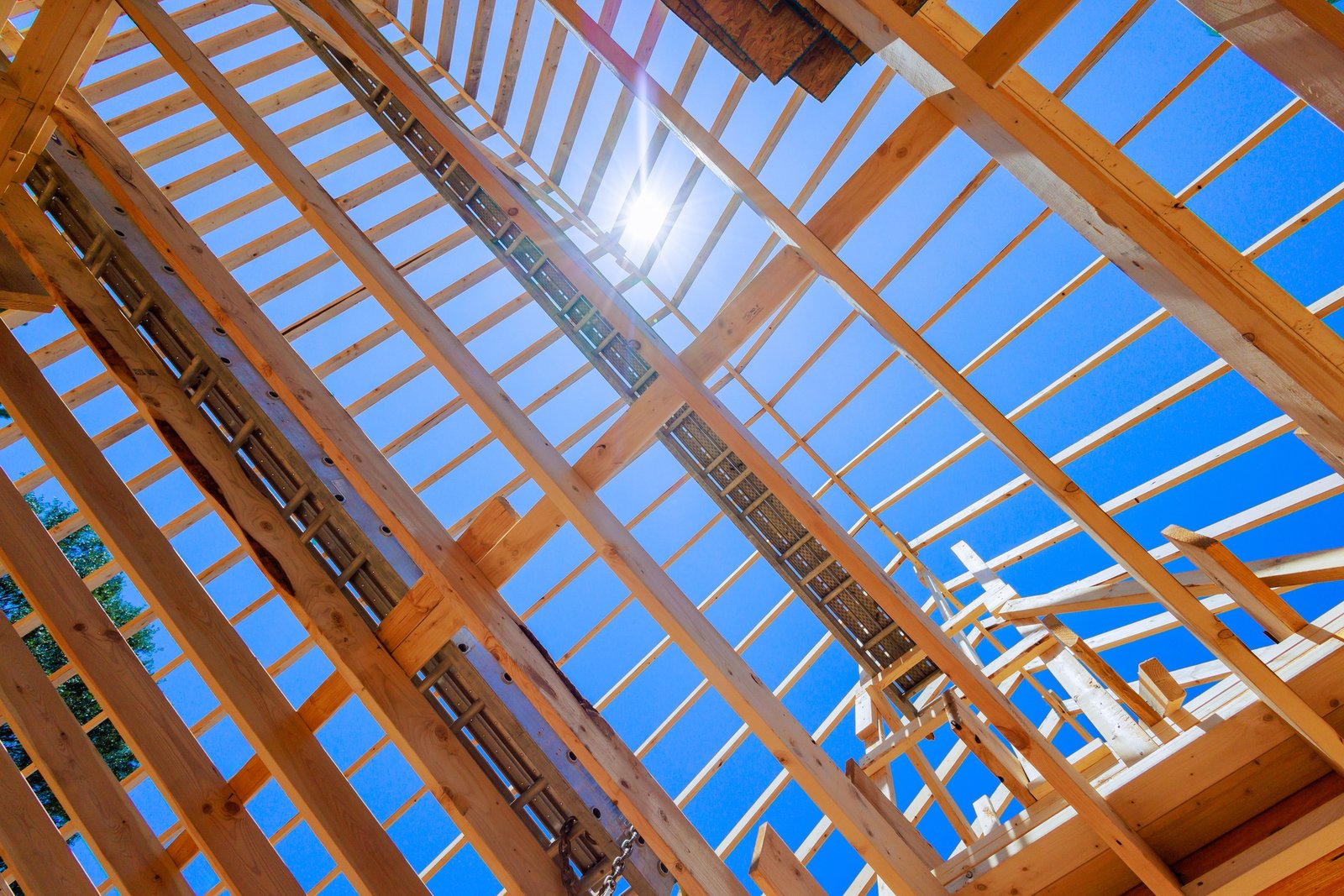Construct wooden roof beams using trusses frames, rafters, a joists